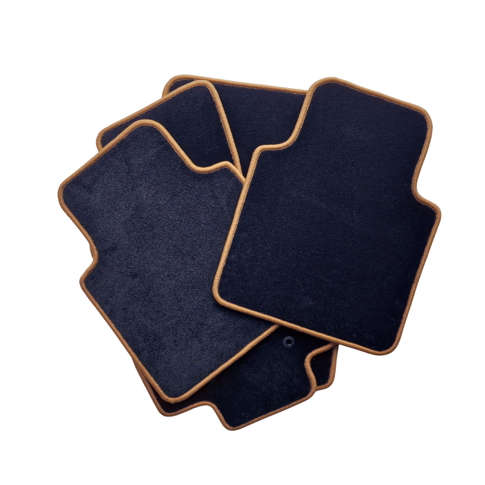 A set of black custom fit car mats for Audi 100/200 1982-1990.